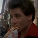 John Travolta eats a slice of pizza in Saturday Night Fever